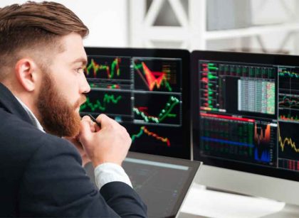 A trader watching futures vs Forex charts