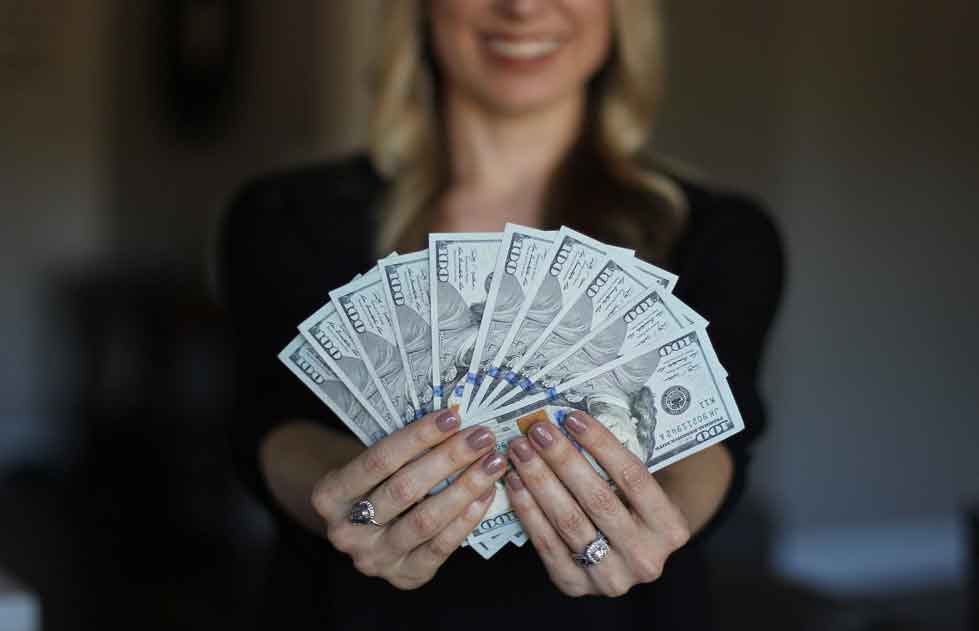 Woman Holding Dollar Bills