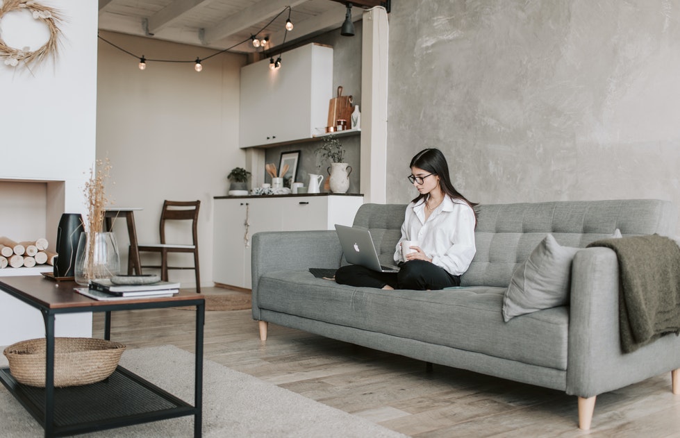 woman learning the basics of online trading on her laptop